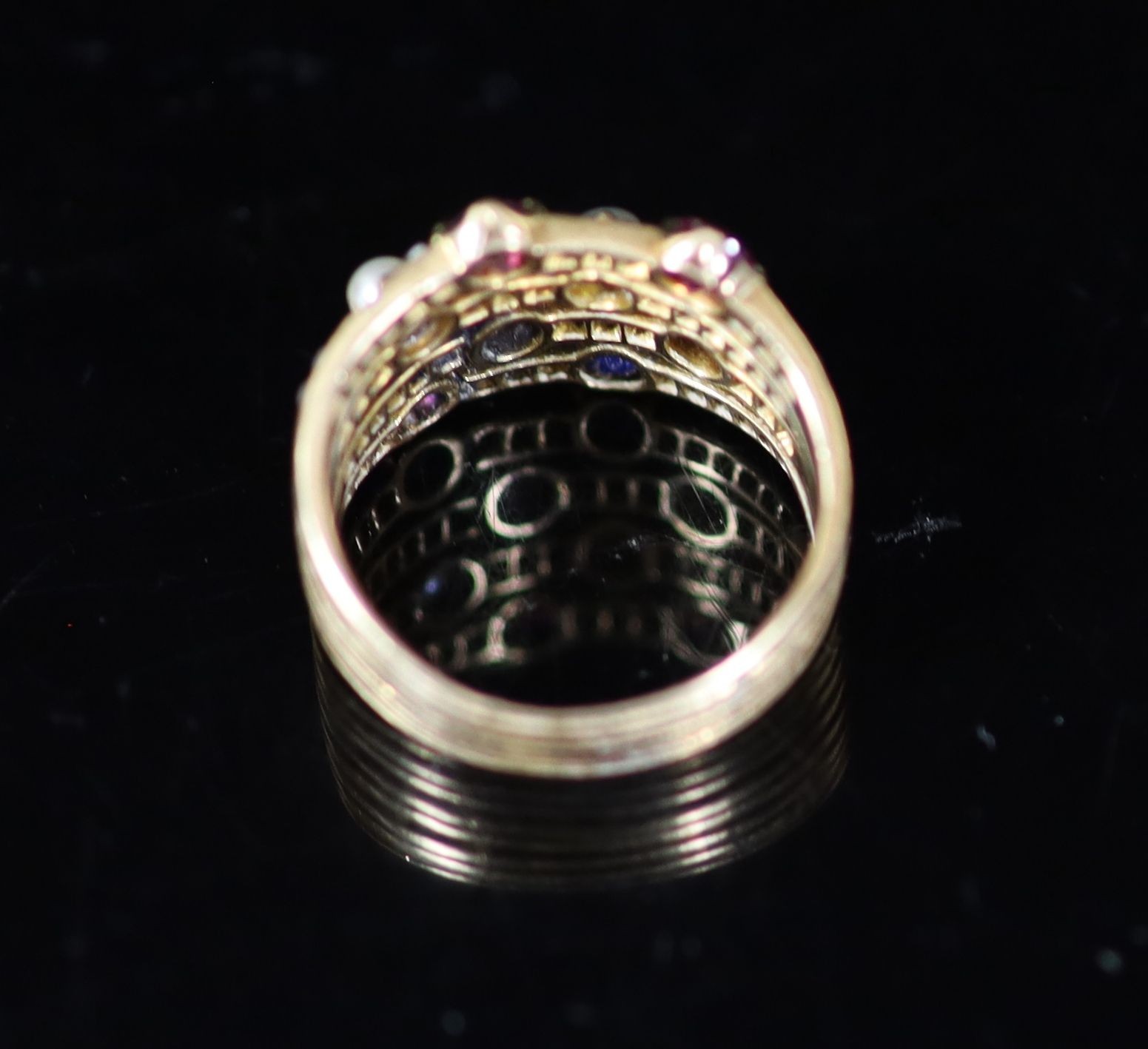 A mid 20th century gold, ruby, diamond sapphire and seed pearl set quadruple shank dress ring